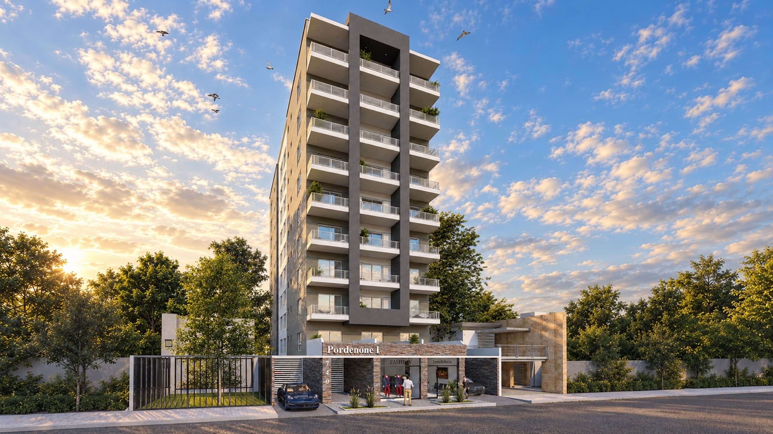 Render de la fachada de Pordenone I al atardecer, con los locales comerciales en planta baja sobre Mansilla