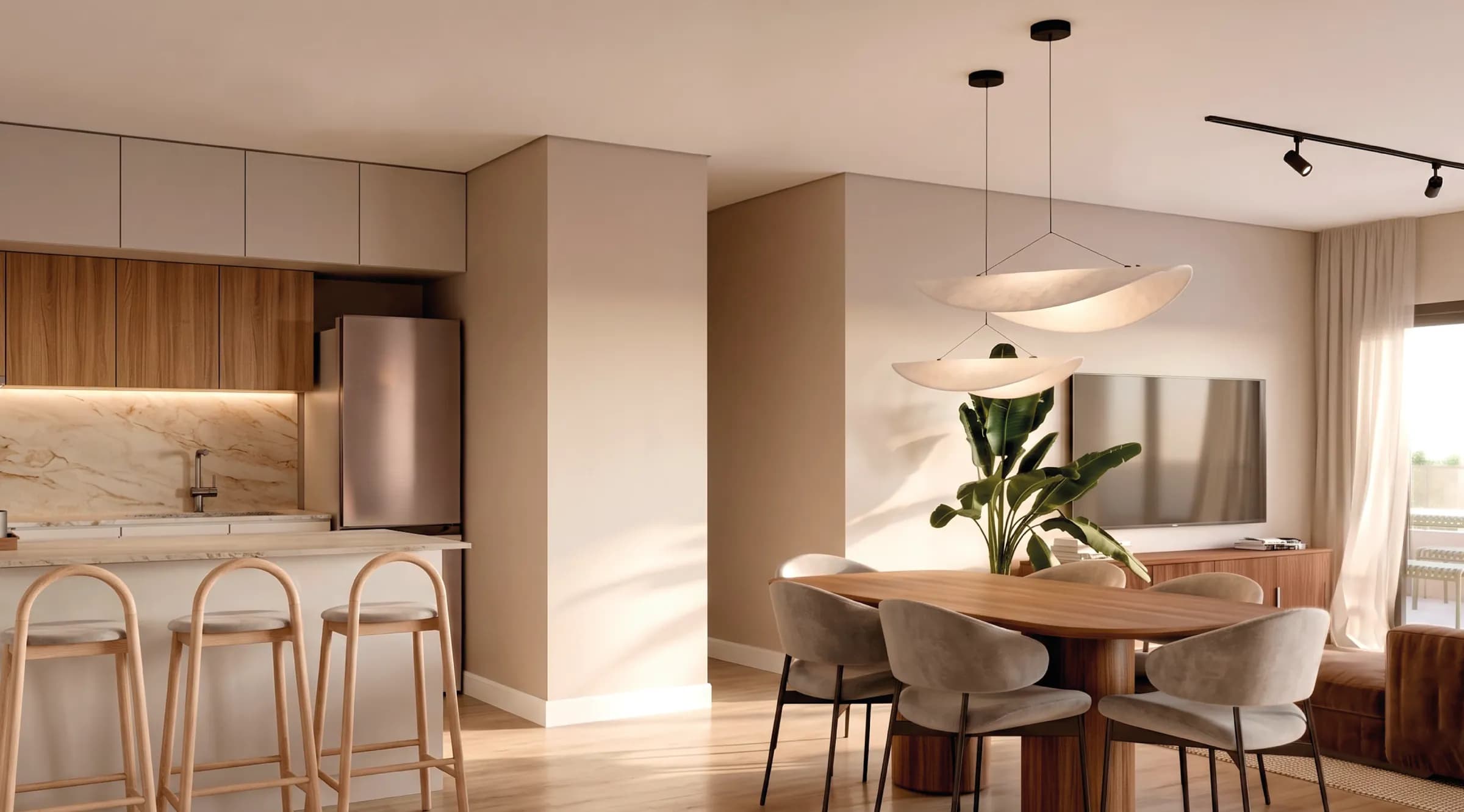 Cocina abierta con isla y desayunador integrada al living comedor